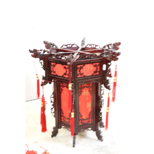 613 - Pair of Chinese Wood Dragon Palace Lanterns with red paper panels and red tassels, 45cm high