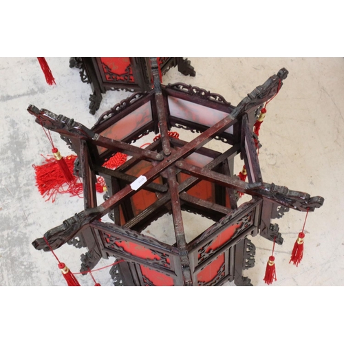 613 - Pair of Chinese Wood Dragon Palace Lanterns with red paper panels and red tassels, 45cm high