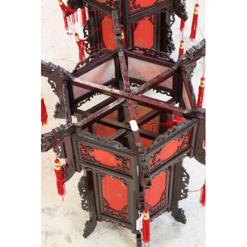 613 - Pair of Chinese Wood Dragon Palace Lanterns with red paper panels and red tassels, 45cm high