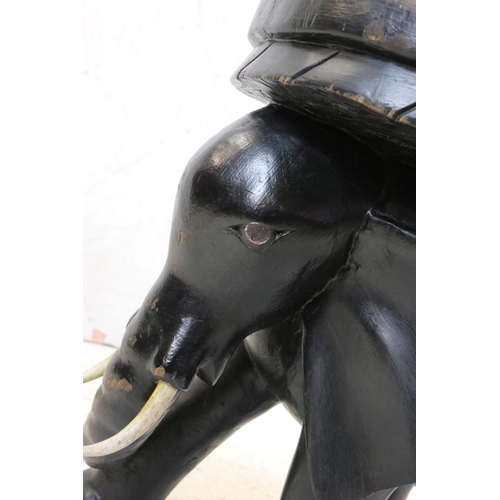 619 - Ebonised Stool in the form of an Elephant, 48cm high