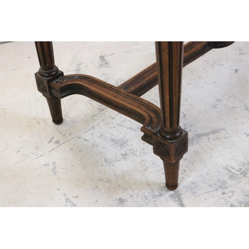 627 - Stained Wood Low Table, the cane inset shaped top with glass cover, carved frieze, raised on carved ... 