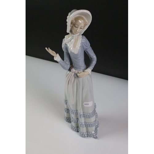 79 - Two Nao by Lladro porcelain figures to include 723 Menina (boxed) and 1049 ' A Big Hug ', together w... 