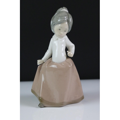 79 - Two Nao by Lladro porcelain figures to include 723 Menina (boxed) and 1049 ' A Big Hug ', together w... 