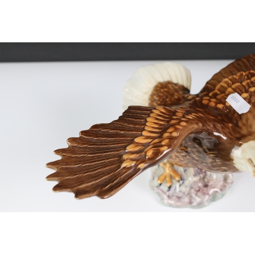 80 - Four Beswick porcelain figures to include 1018 Bald Eagle (33cm wingspan), ' Spirit of the Wind ' mo... 