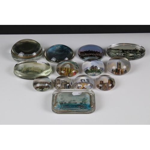 92 - 13 glass paperweights, 19th century onwards, mostly with applied printed souvenir views, featuring B... 