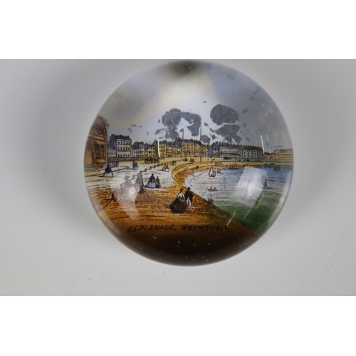 92 - 13 glass paperweights, 19th century onwards, mostly with applied printed souvenir views, featuring B... 