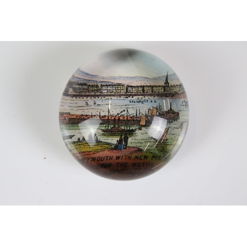 92 - 13 glass paperweights, 19th century onwards, mostly with applied printed souvenir views, featuring B... 