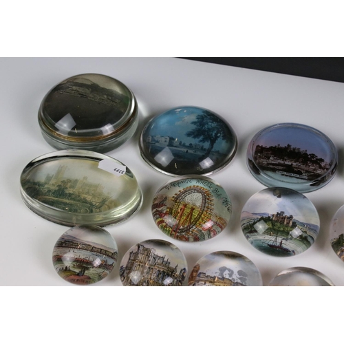 92 - 13 glass paperweights, 19th century onwards, mostly with applied printed souvenir views, featuring B... 