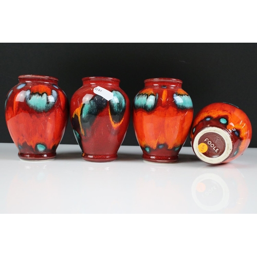 94 - Poole Pottery - Three Poole ' Volcano ' pattern Living Glaze vases (11cm high), together with a simi... 