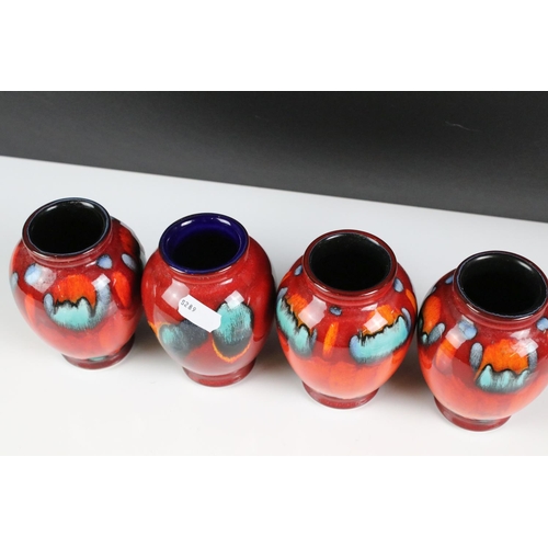 94 - Poole Pottery - Three Poole ' Volcano ' pattern Living Glaze vases (11cm high), together with a simi... 