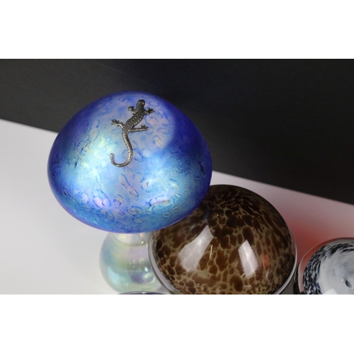 96 - Collection of 21 glass paperweights to include a Heron Glass blue iridescent mushroom paperweight wi... 