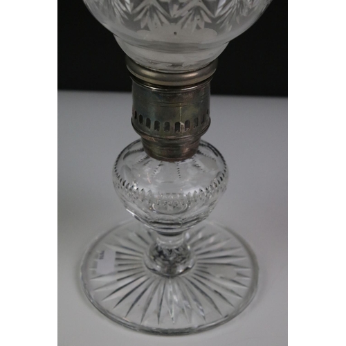 107 - Thomas Webb cut glass oil lamp, the shade of baluster form with star-cut design, raised on a star-cu... 