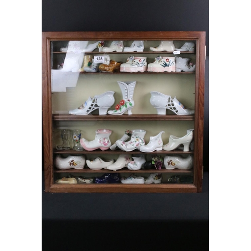 128 - Collection of 36 ceramic & glass shoes to include Palissy, Kildsware and Old Foley examples, housed ... 