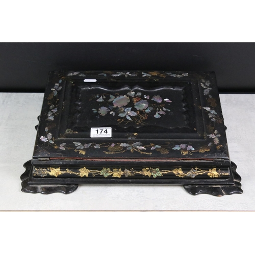 174 - Victorian black lacquered writing slope with abalone shell floral inlay to the hinged lid, gilt pain... 