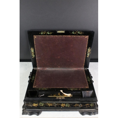 174 - Victorian black lacquered writing slope with abalone shell floral inlay to the hinged lid, gilt pain... 