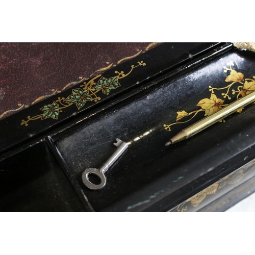 174 - Victorian black lacquered writing slope with abalone shell floral inlay to the hinged lid, gilt pain... 