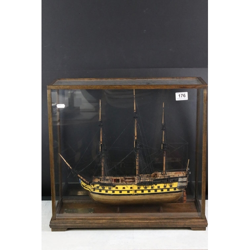 176 - Scratch-built painted wooden model of a 64 Gun Ship (1750), with detailed rigging, cased, measures a... 