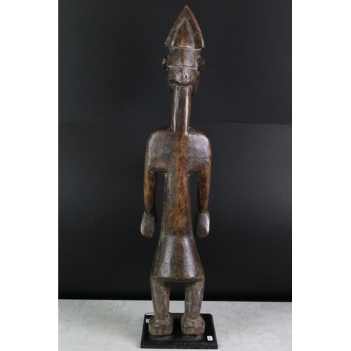 185 - Carved hardwood South African figural golf trophy, modelled as a stylised nude female, raised on a s... 