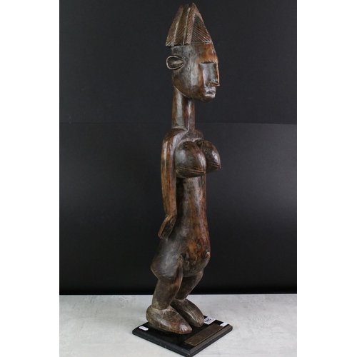 185 - Carved hardwood South African figural golf trophy, modelled as a stylised nude female, raised on a s... 