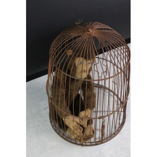 189 - Mid 20th C straw-filled jointed monkey toy (approx 37cm tall), together with a dome-topped wire bird... 