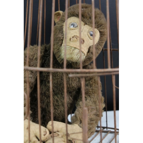 189 - Mid 20th C straw-filled jointed monkey toy (approx 37cm tall), together with a dome-topped wire bird... 