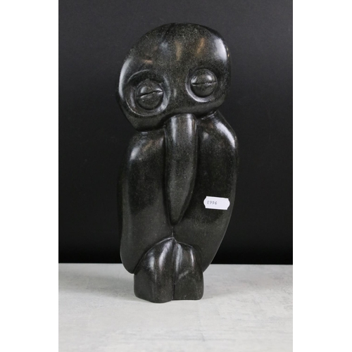 190 - Two Zimbabwean polished stone sculptures to include ' Happy Man ' by Richard Mteki (29cm high), and ... 