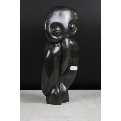 190 - Two Zimbabwean polished stone sculptures to include ' Happy Man ' by Richard Mteki (29cm high), and ... 