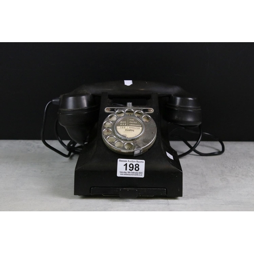 198 - A vintage black telephone, marked 'Call Exchange' complete with lower drawer.