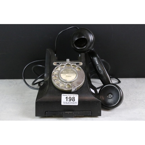 198 - A vintage black telephone, marked 'Call Exchange' complete with lower drawer.