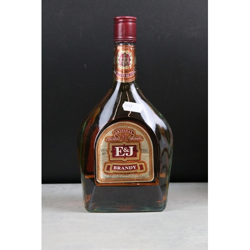 392 - A collection of three sealed bottles of Brandy to include E&J, Hennessy and Courvoisier.