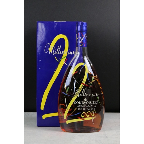 392 - A collection of three sealed bottles of Brandy to include E&J, Hennessy and Courvoisier.