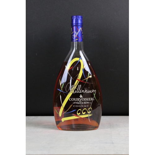 392 - A collection of three sealed bottles of Brandy to include E&J, Hennessy and Courvoisier.