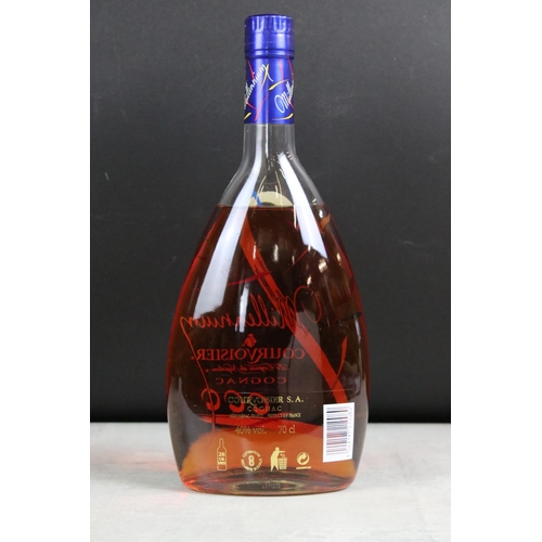 392 - A collection of three sealed bottles of Brandy to include E&J, Hennessy and Courvoisier.