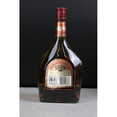 392 - A collection of three sealed bottles of Brandy to include E&J, Hennessy and Courvoisier.