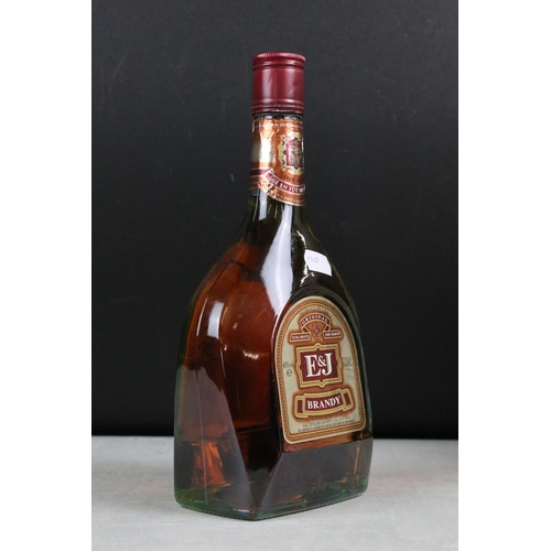 392 - A collection of three sealed bottles of Brandy to include E&J, Hennessy and Courvoisier.