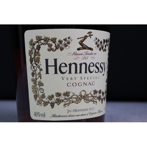 392 - A collection of three sealed bottles of Brandy to include E&J, Hennessy and Courvoisier.