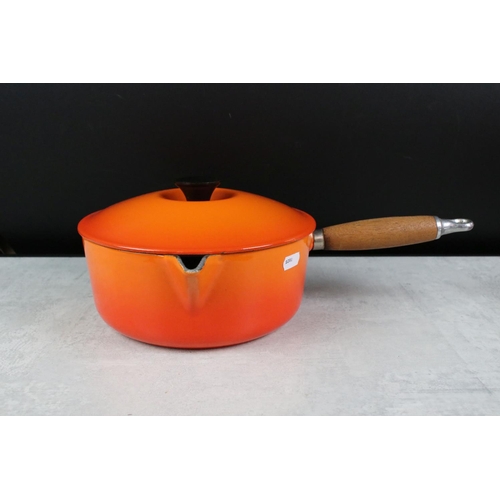 366 - Le Creuset Volcanic set of Four Cast Iron Saucepans, sizes 14, 16, 20 and 22 with three matching lid... 