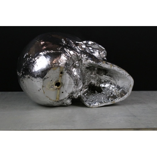 372 - Model of a Silvered Skull together with Two Brass Hot Water Bottles