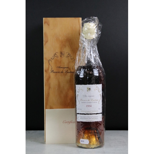 401 - A bottle of Baron De Lustrac Armagnac 1954, sealed bottle within wooden case.