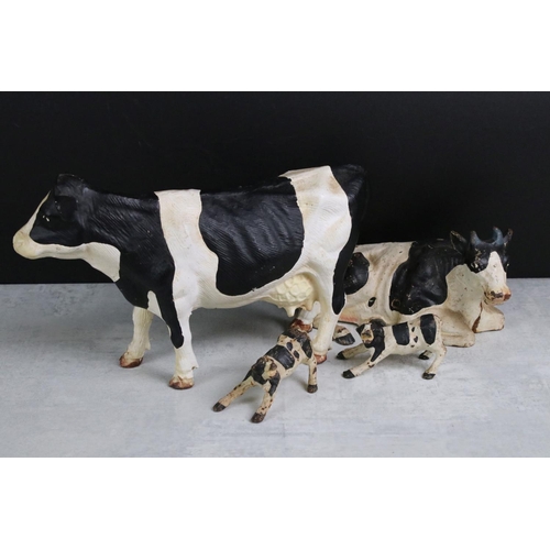 350 - A collection of four Butchers advertising cast iron friesian cows