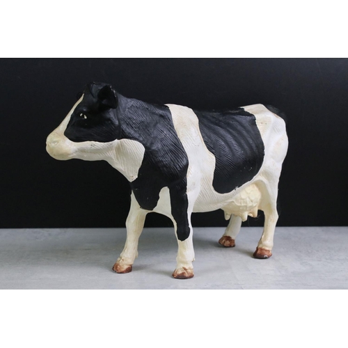 350 - A collection of four Butchers advertising cast iron friesian cows