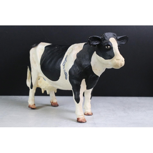 350 - A collection of four Butchers advertising cast iron friesian cows