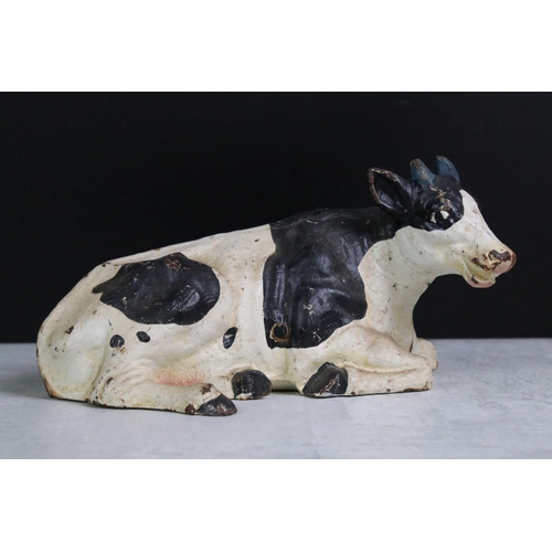 350 - A collection of four Butchers advertising cast iron friesian cows