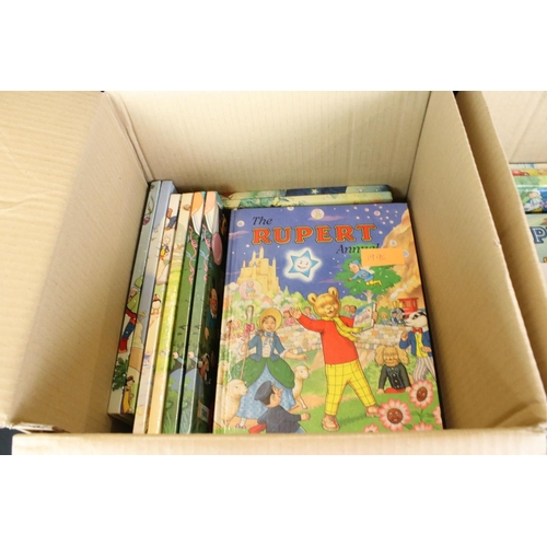 415 - A large collection of approx eighty Rupert the Bear annual and books dating from the 1960's onwards.