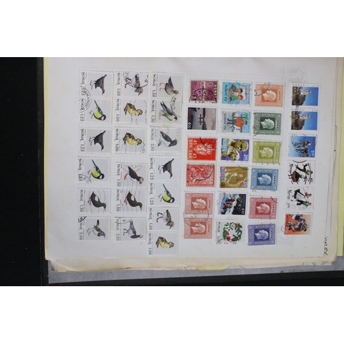 419 - A large collection of mainly world stamps mounted to sheets and contained within seven binders.