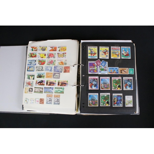 419 - A large collection of mainly world stamps mounted to sheets and contained within seven binders.