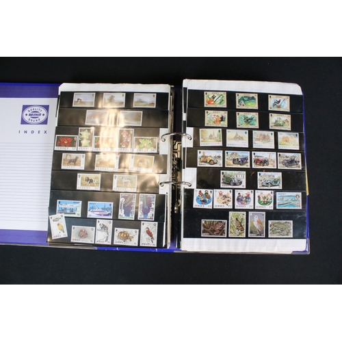 419 - A large collection of mainly world stamps mounted to sheets and contained within seven binders.