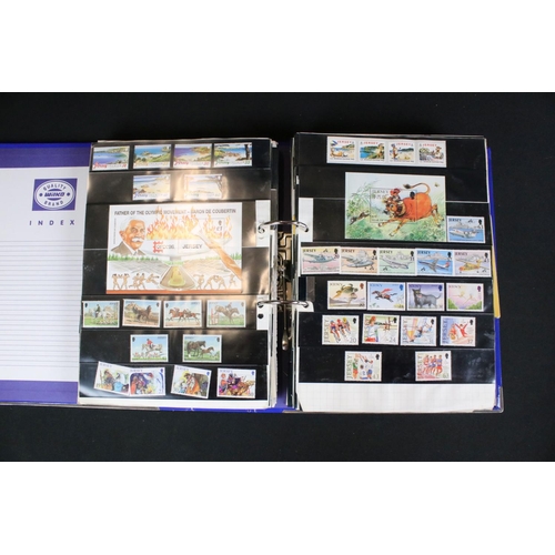 419 - A large collection of mainly world stamps mounted to sheets and contained within seven binders.