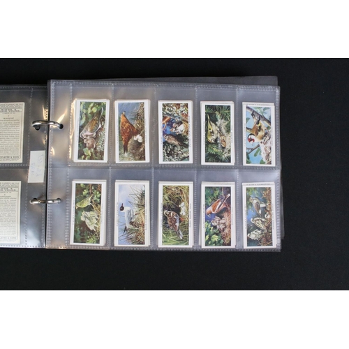 421 - A large collection of mixed cigarette cards, full sets and parts sets to include players, wills ...e... 