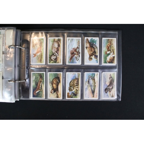 421 - A large collection of mixed cigarette cards, full sets and parts sets to include players, wills ...e... 